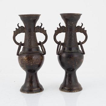 A pair of Chinese bronze altar vases, Ming dynasty (1368-1644).