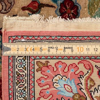 A Qum silk rug, c. 110 x 76 cm.