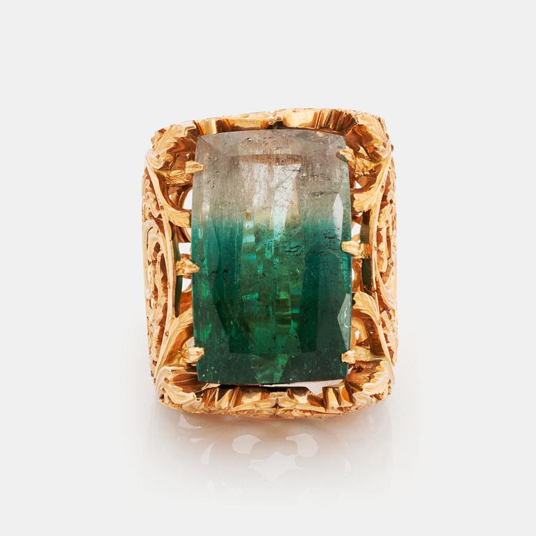 A Tina Karlsson ring in 18K gold set with a large step-cut tourmaline.