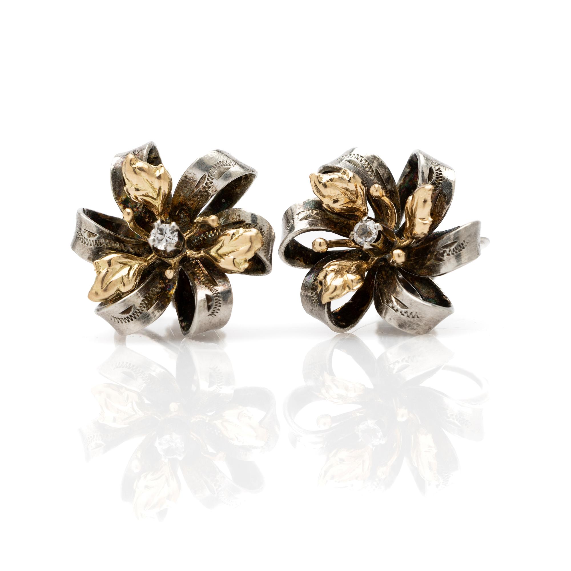 Earrings, a pair, silver and 14k gold with brilliant-cut diamond.