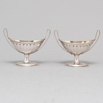 A pair of parcel-gilt empire silver salt cellars, 19th century.