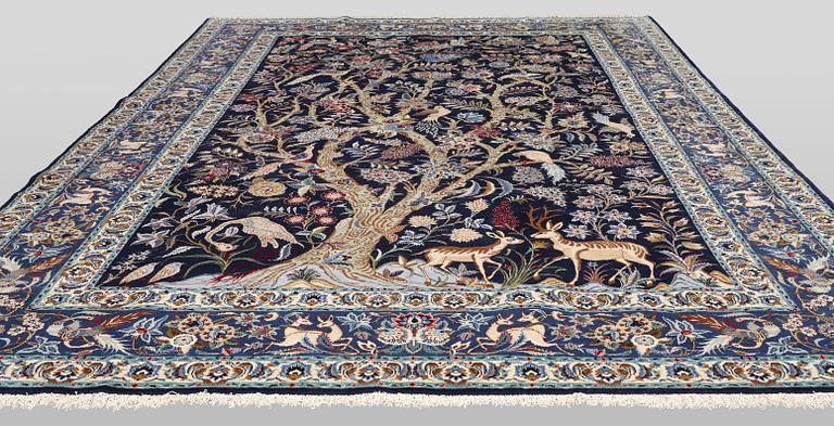 A pictoral Keshan carpet, part silk, signed, c. 393 x 272 cm.