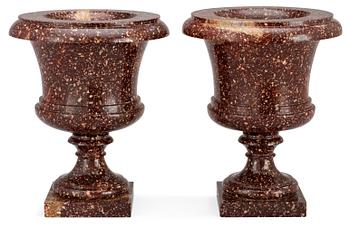 A pair of Swedish first half 19th century porphyry urns.