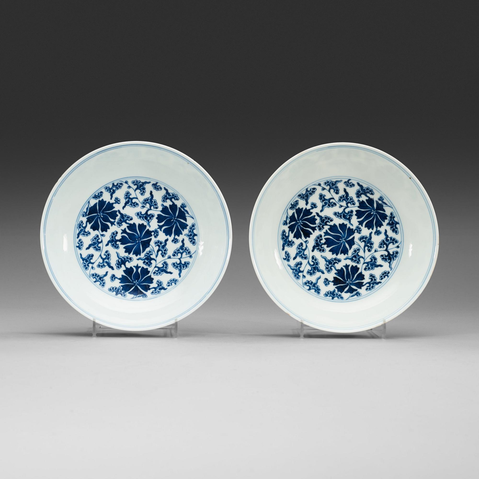 A pair of blue and white lotus dishes, Qing dynasty (1644-1912) with Qianlong seal mark.