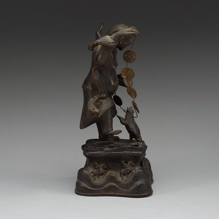 A bronze figure of Liu Hai with money and a three legged toad, Qing dynasty (1644-1912).