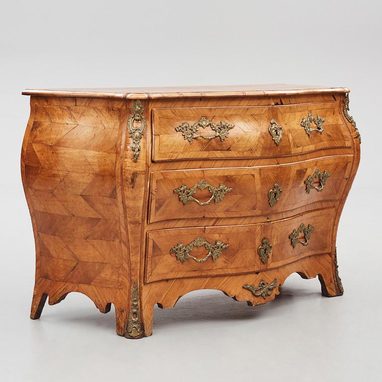 A brass-mounted and marquetry rococo commode, later part of the 18th century.