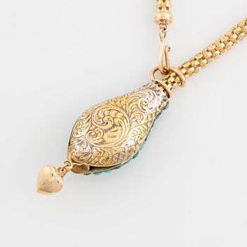 Necklace in gold in the shape of a serpent with turquoise and rubies.