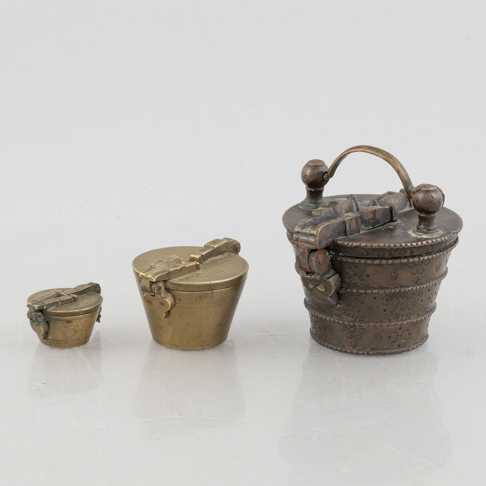 A set of three Nuremberg brass nested cup weights, one by Christoph or Johan Conrad Schön (masters 1746(1750).