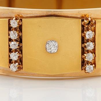 An 18K gold bracelet set with old-cut diamonds.