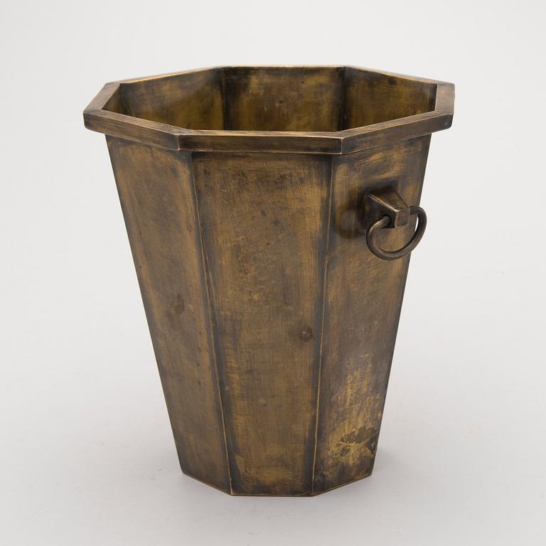 A patinated brass champagne bucket from the first half of the 20th Century.
