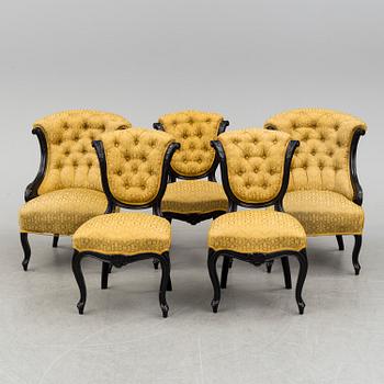 A set of three chairs, two easy chairs, one sofa and one table, end of the 19th century.