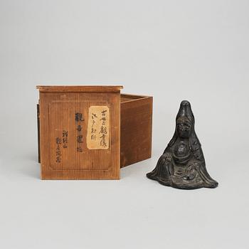 A potted black glazed Kannon, Japan, Edo period (1603-1868).