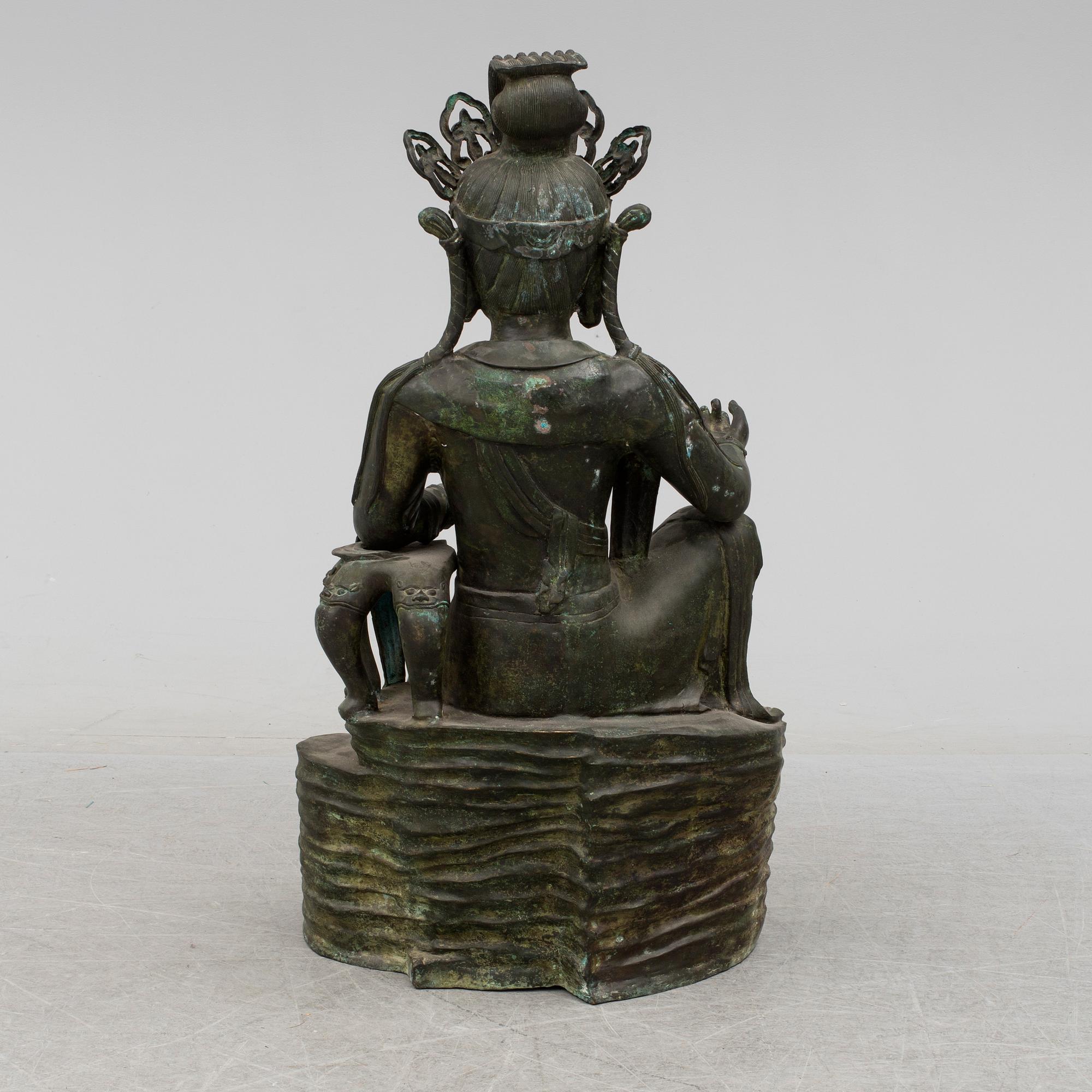 A mid 20th century metal Guan Yin figurine, China.