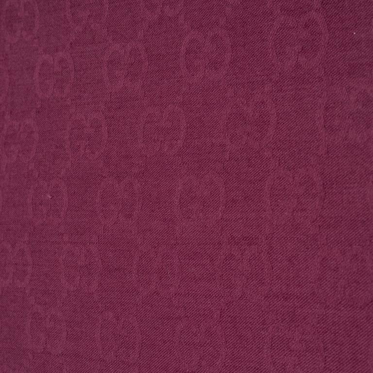 Gucci, a wool and silk mix "GG" jaquard shawl.