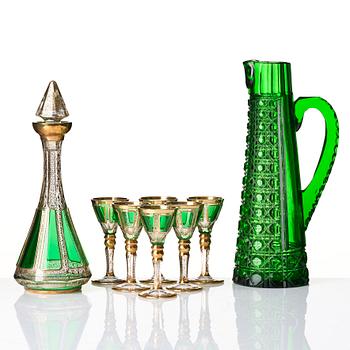 A glass service, a decanter with stopper and six glasses, also a pitcher, 20th century.