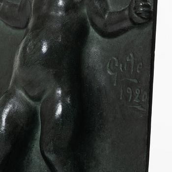 Axel Gute, a pair of patinated bronze bookends, dated 1920.