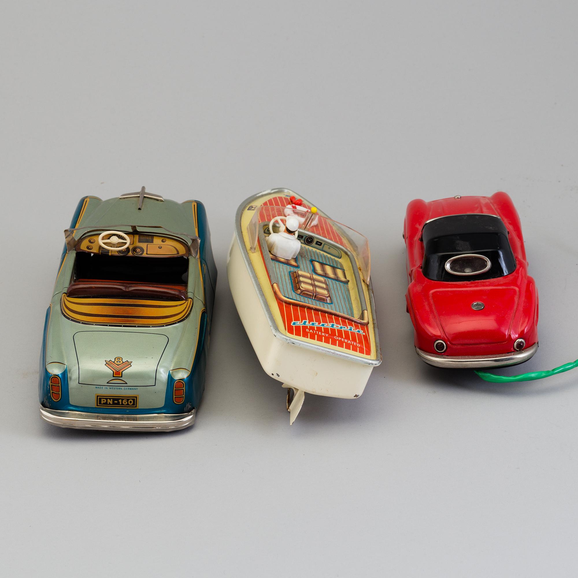 THREE TIN PLATE TOYS, mid 20th century.