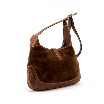 GUCCI, a brown suede shoulder bag.