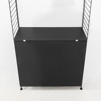 Nils Strinning, Hyllsystem.