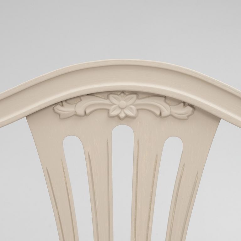 A Gustavian Style Dining Table and 10 Chairs, second half of the 20th Century.