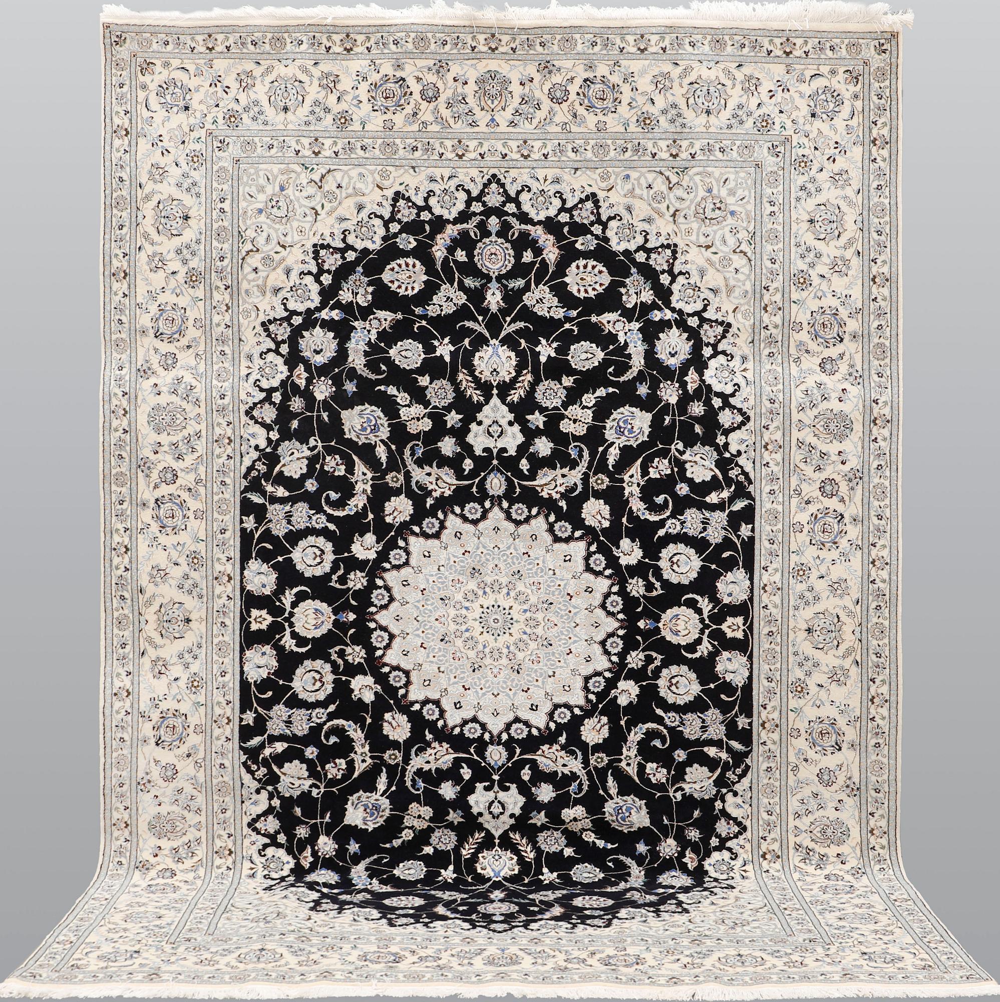 A Nain part silk carpet, 310 x 204 cm.
