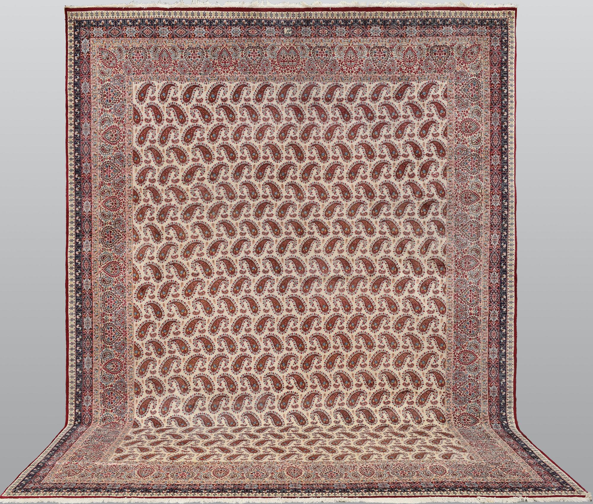 A Kirman carpet, signed, c. 390 x 295 cm.