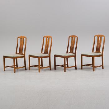 A Carl Malmsten "Ambassadör" dining table and four chairs  , second half of the 20th century. One extension leaf.