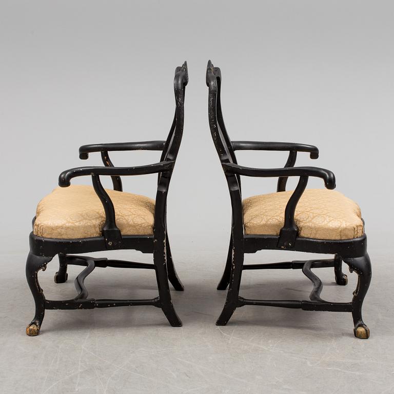 A pair of 18th century armchairs.