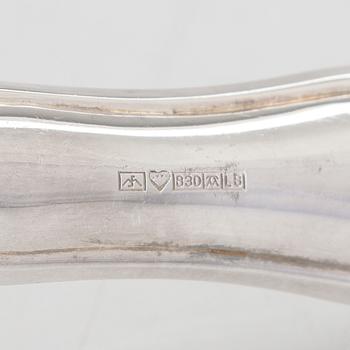 A 78-piece silver 'Chippendale' cutlery set, 1978-2007. Various Finnish manufacturers.