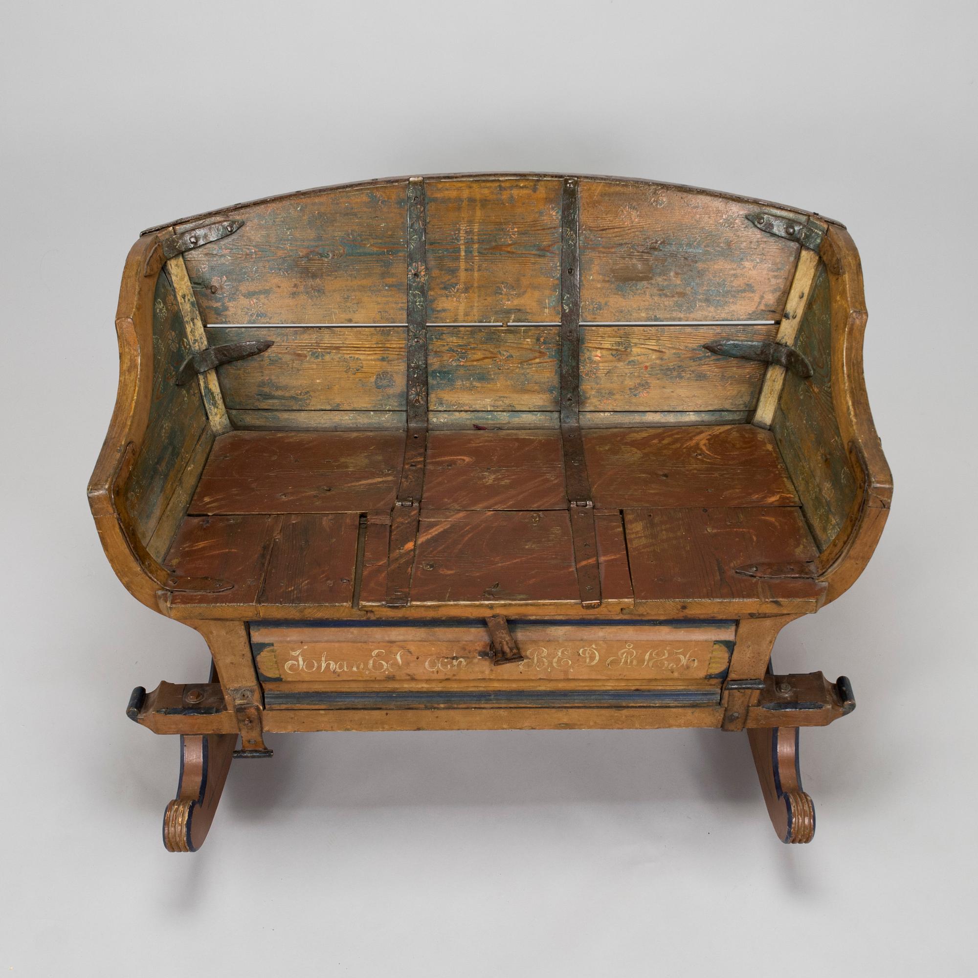 A 19th-century wooden sleigh.