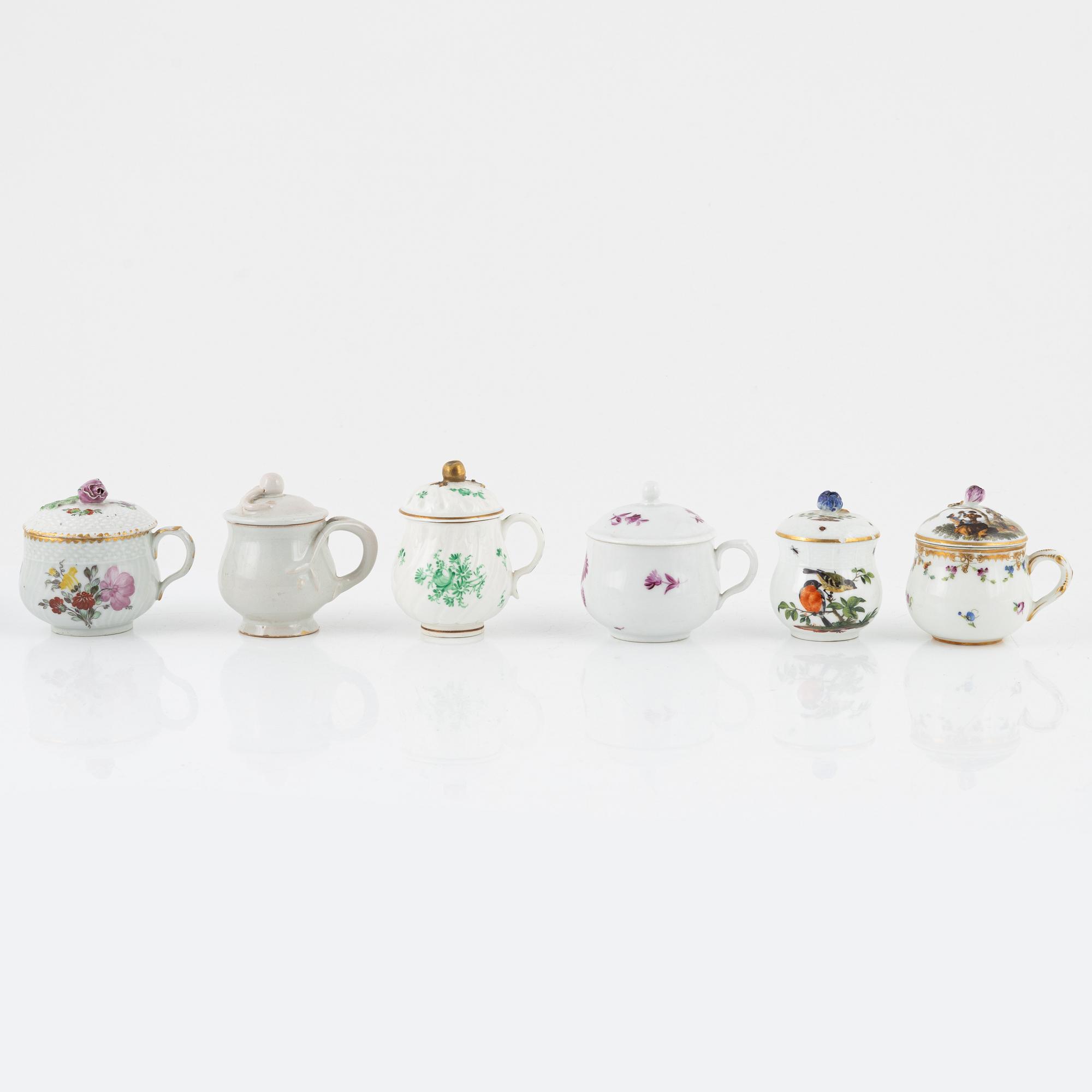 Two dinner plates and 11 custard cups with covers, 18th/20th Century.