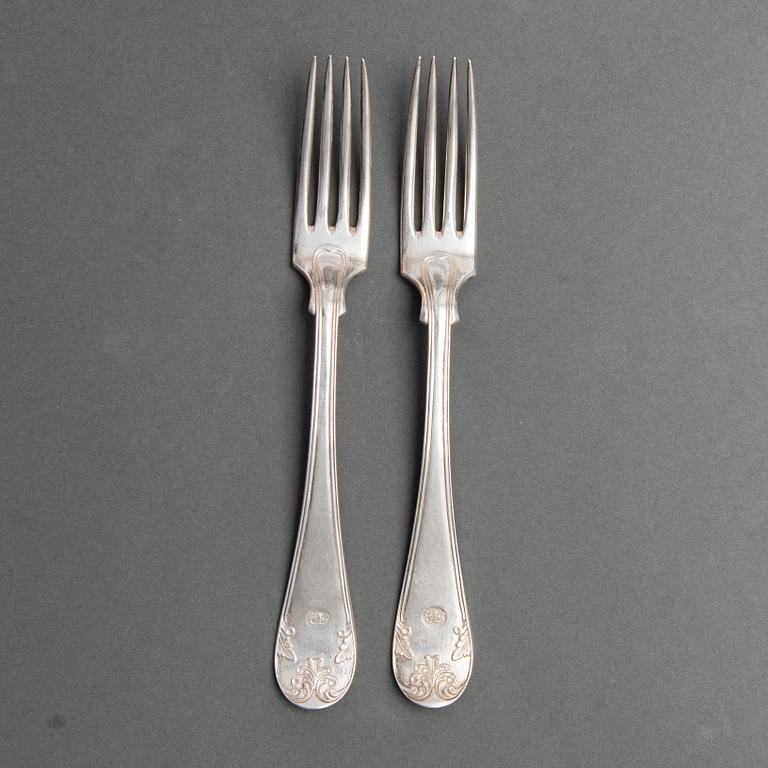 A SET OF 24 AND 12 SWEDISH SILVER FORKS, different makers marks.