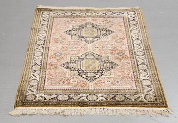 A rug, an old silk Qum, ca 158 x 104,5 cm (as well as ca 2 cm flat weave at the ends).