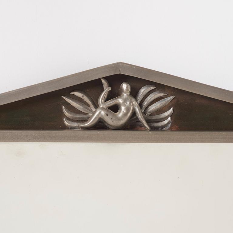Nils Fougstedt, a Swedish Grace pewter and brass mirror model "137 a", Firma Svenskt Tenn, Stockholm 1927.