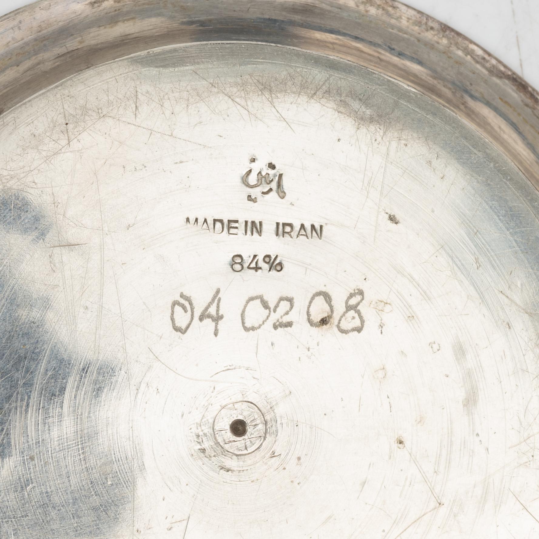 A Persian silver tray, 12 small spoons and six coasters, first part of the 1900s.