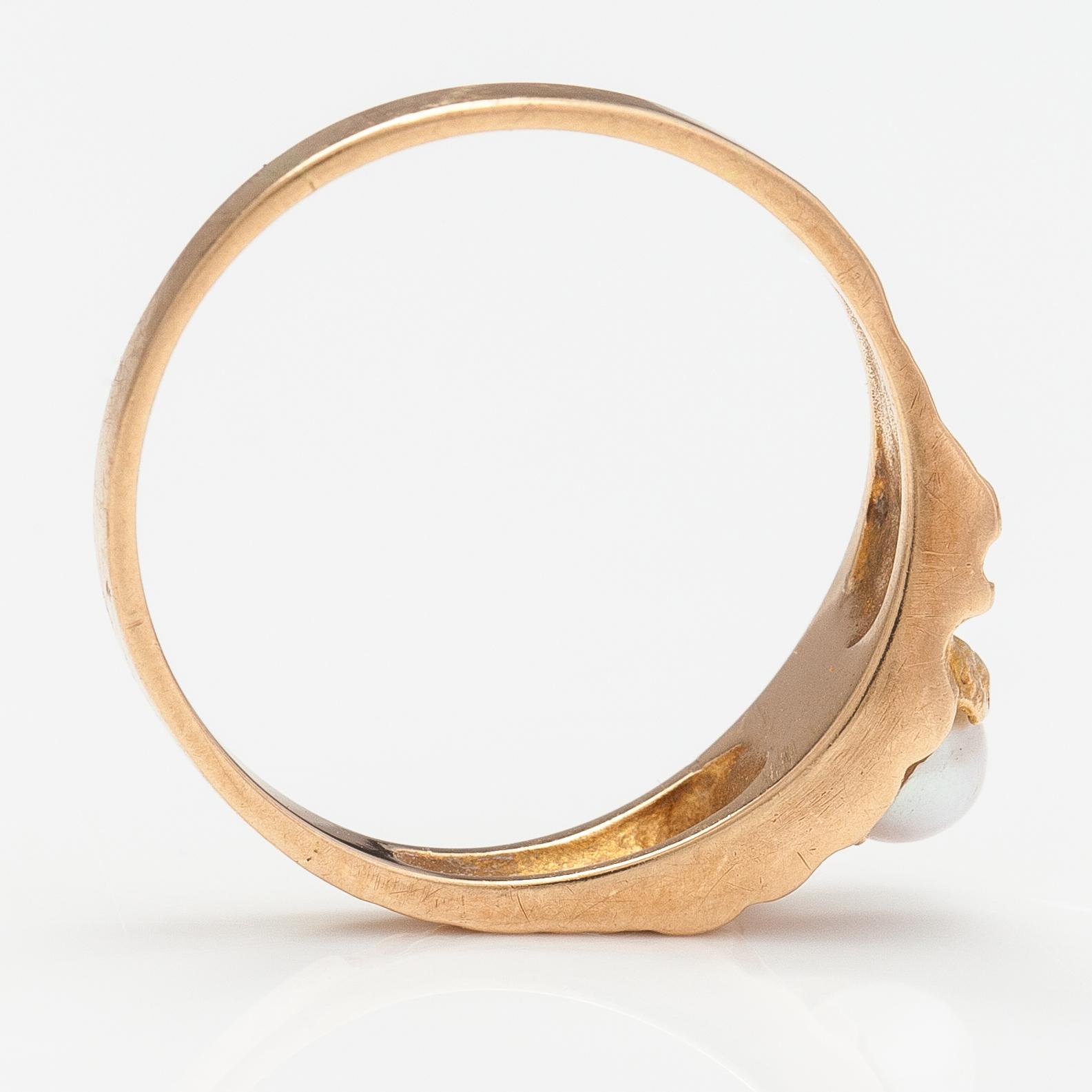 A 14K gold ring "Small word" with a cultured pearl. Lapponia 1978.
