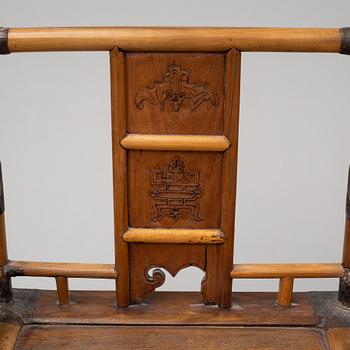 A pair of Chinese wooden armchairs, late 19th/early 20th century.