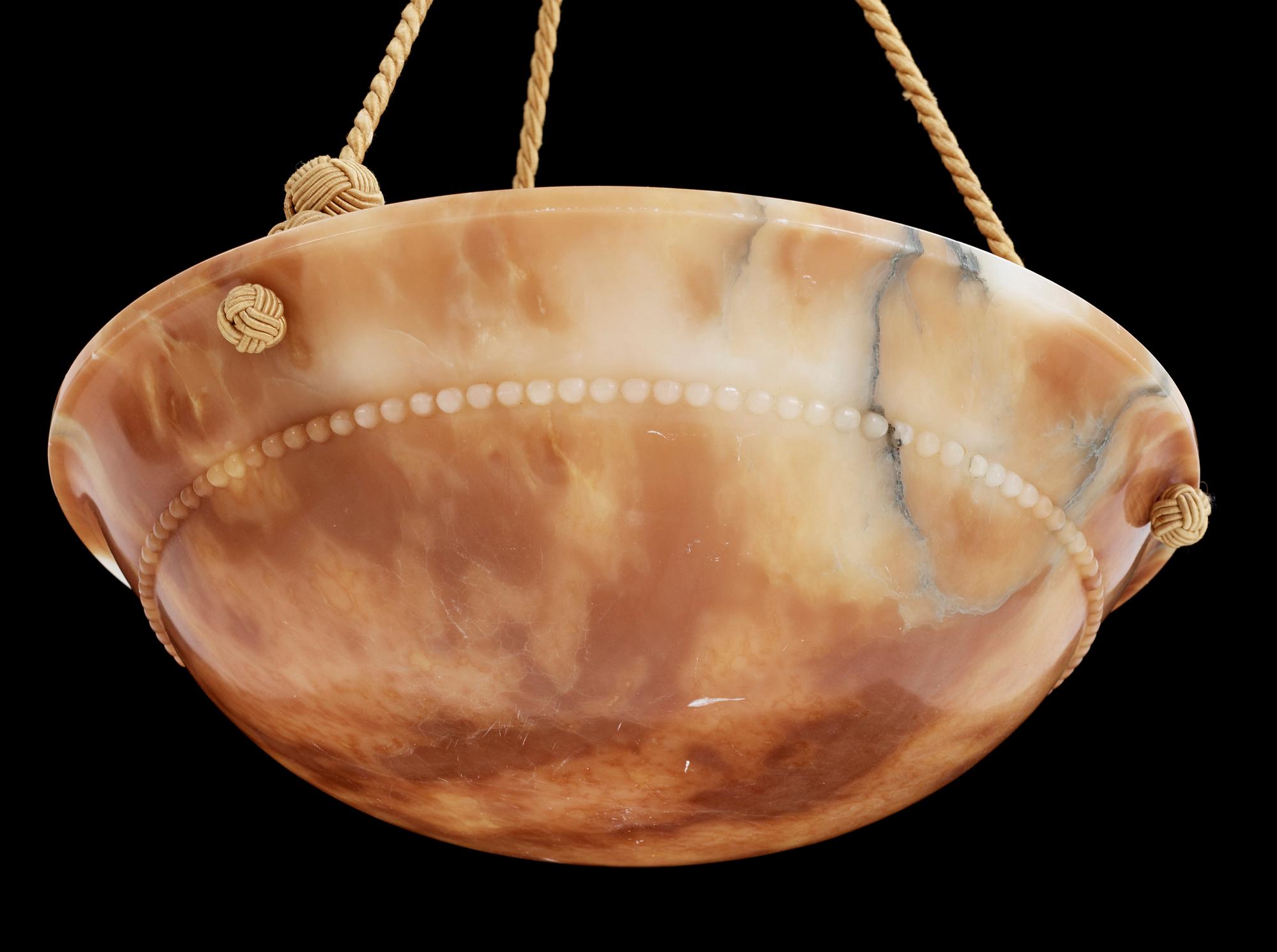 TAKAMPEL, alabaster, 1910/20-tal. Höjd 70 cm.