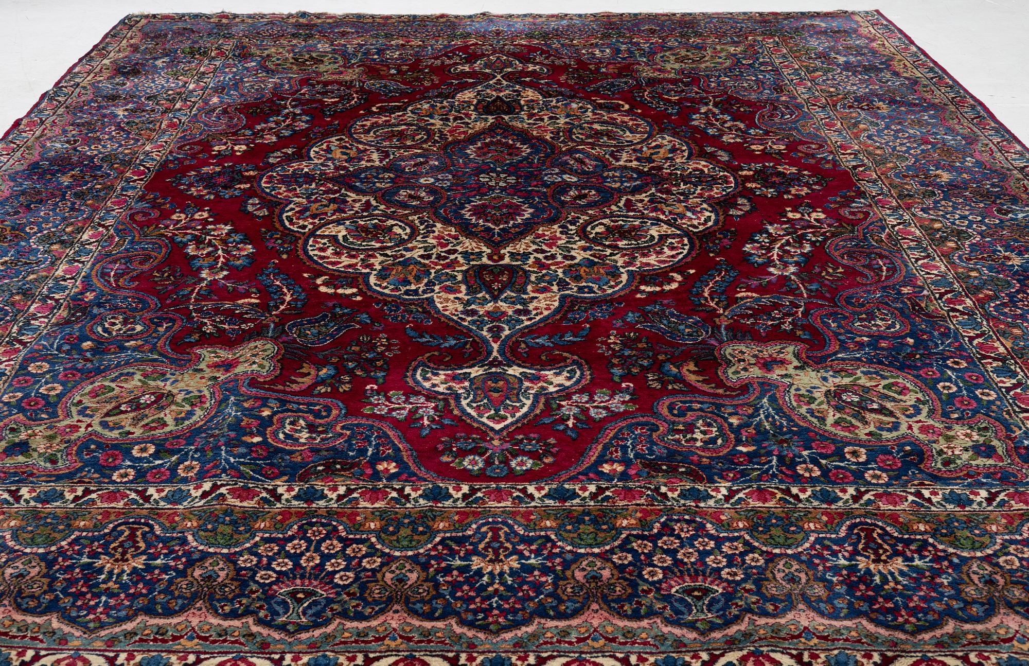 A Kerman carpet, c. 365 x 265 cm.