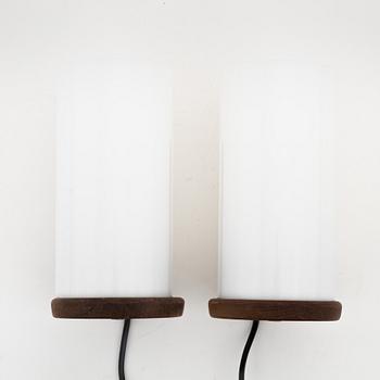 Uno & Östen Kristiansson, a apir of teak and acrylic table lights, Luxus, Vittsjö.