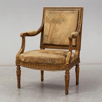 A late 19th century Louis XVI-style armchair.