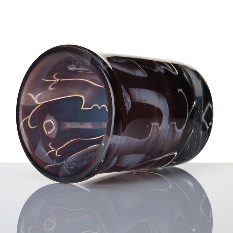 Ingeborg Lundin, an 'ariel' burgundy coloured glass vase decorated with faces, Orrefors Sweden 1972.