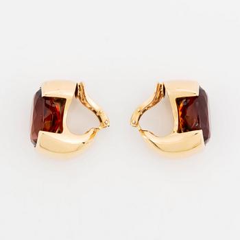 A pair of Tina Karlsson earrings in 18K gold set with faceted citrines.