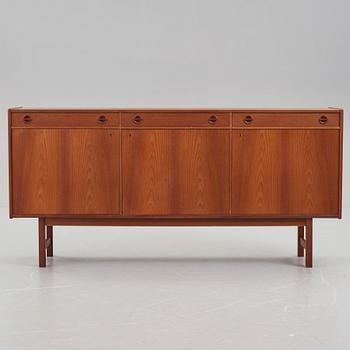 A late 20th Century teak veneered sideboard.