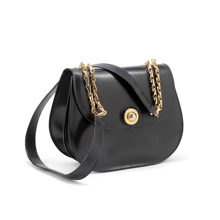 CÈLINE,  a navyblue leather handbag.