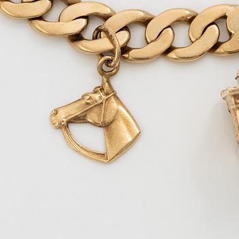 Bracelet 18K gold with charms.