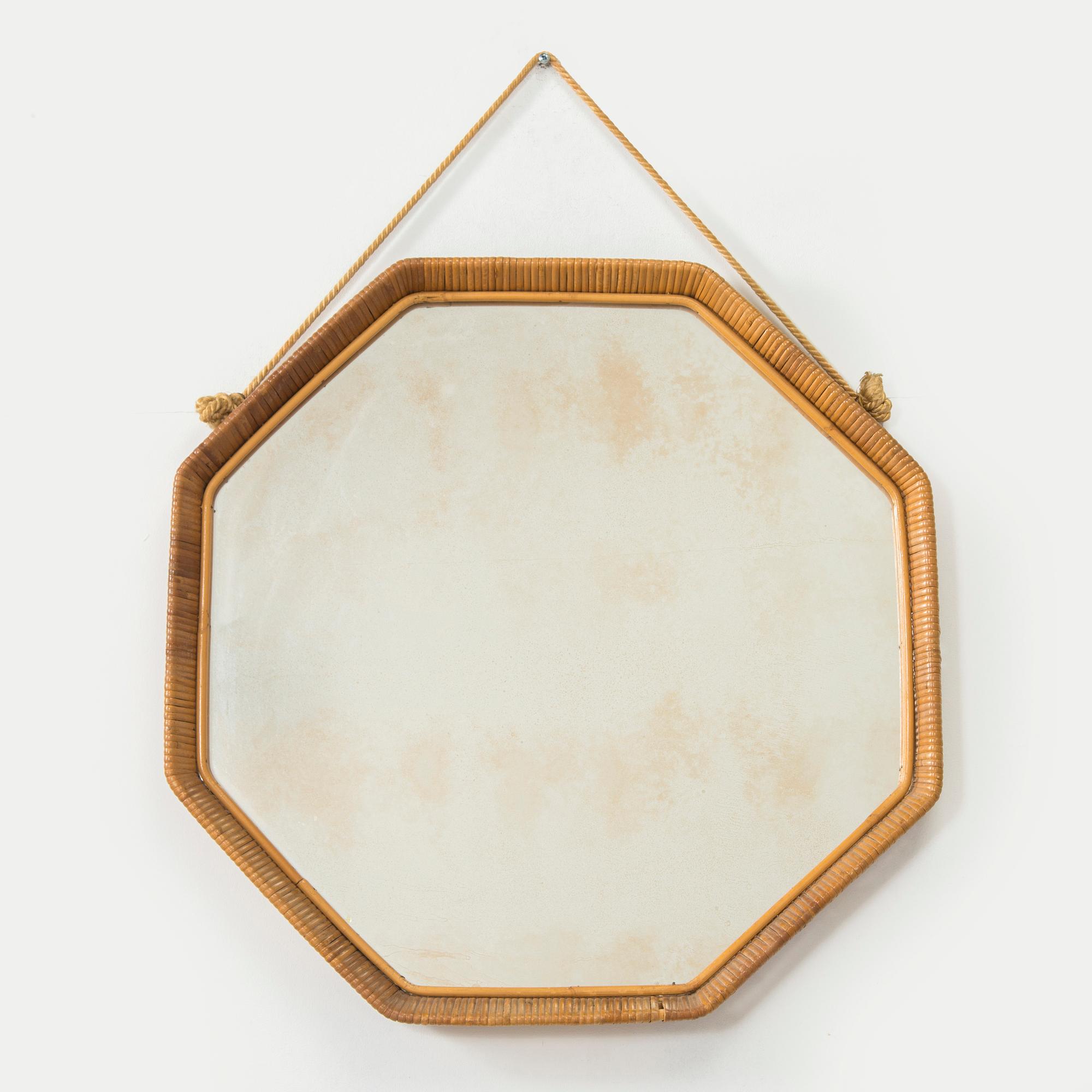 A 1950s rattan mirror.