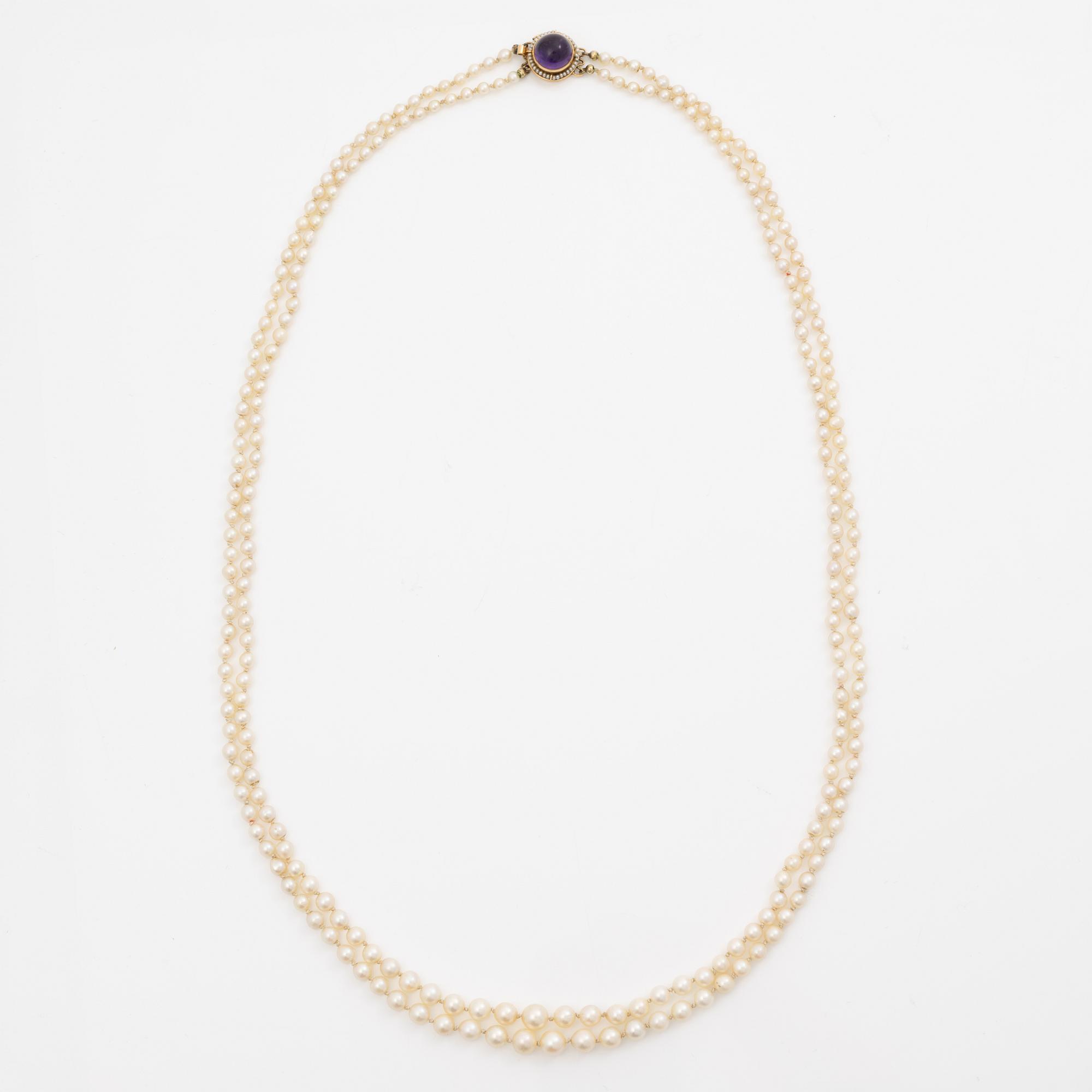 Cultured pearl necklace, double-strand with graduated pearls, Stigbert 18K gold clasp set with a cabochon-cut amethyst.