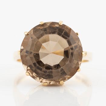 Ring in 18K gold with faceted smoky quartz, Stigbert.
