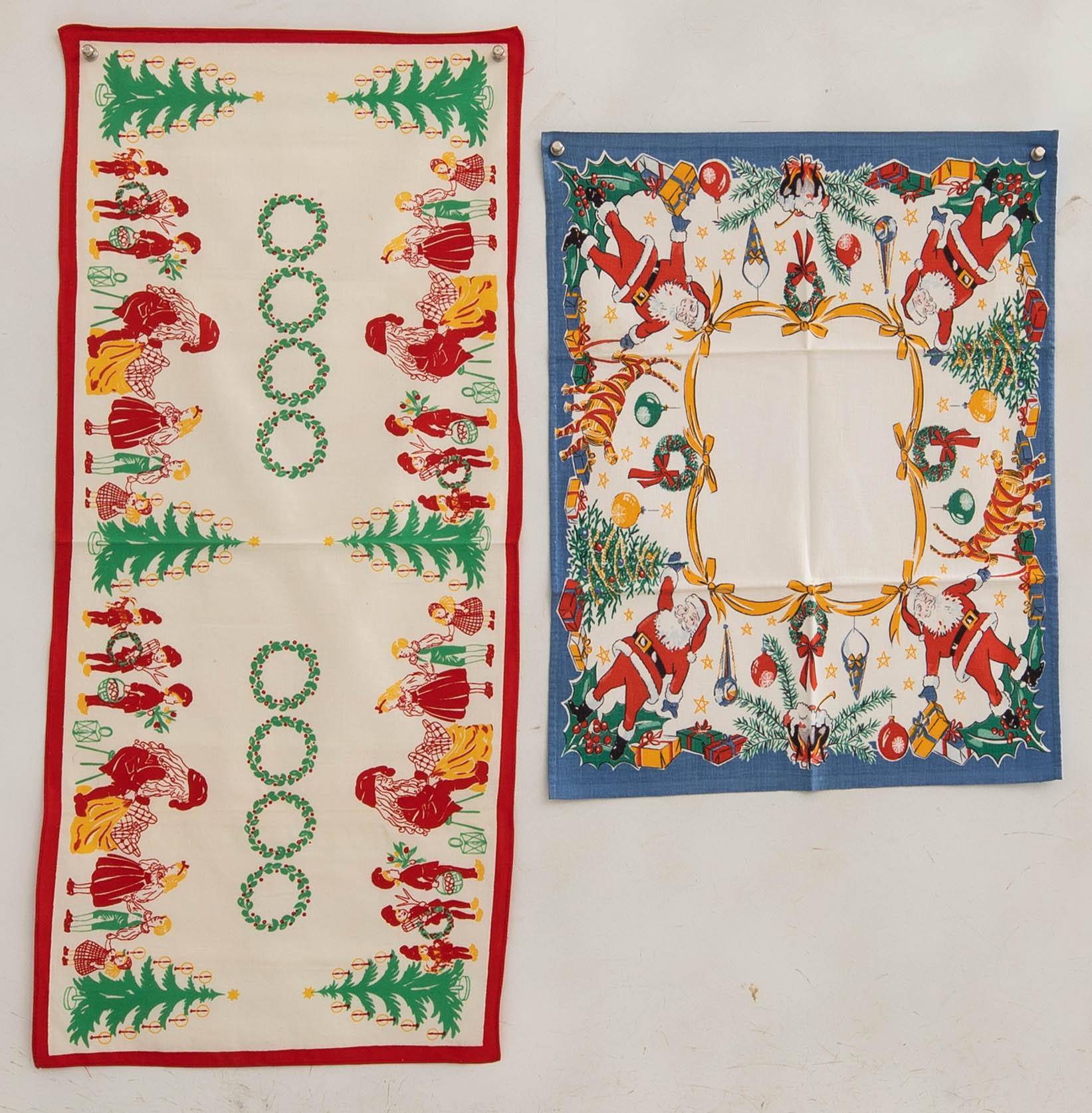A collection of smaller Christmas tablecloths, runners, and wall hangings, approximately 34 pieces, mid/second half of the 20th century.